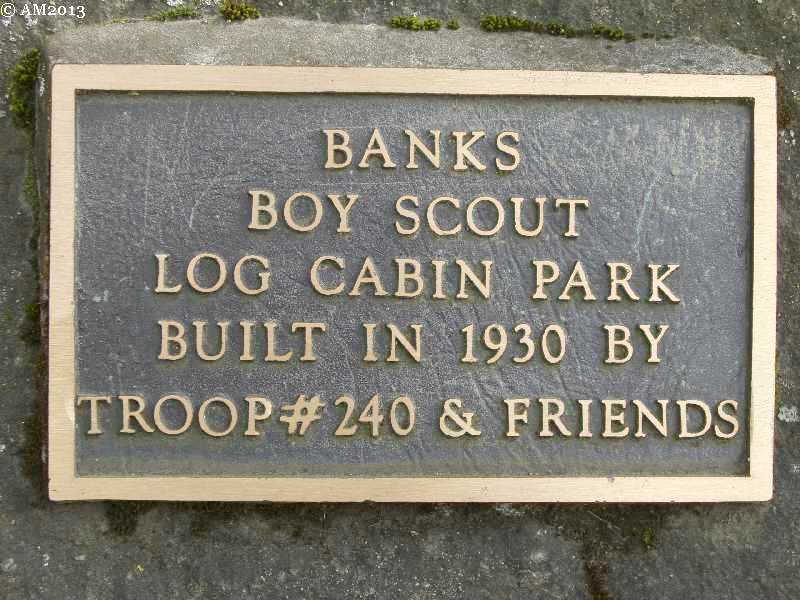 This bronze plaque notes that the boy scouts built this log cabin in 1930
